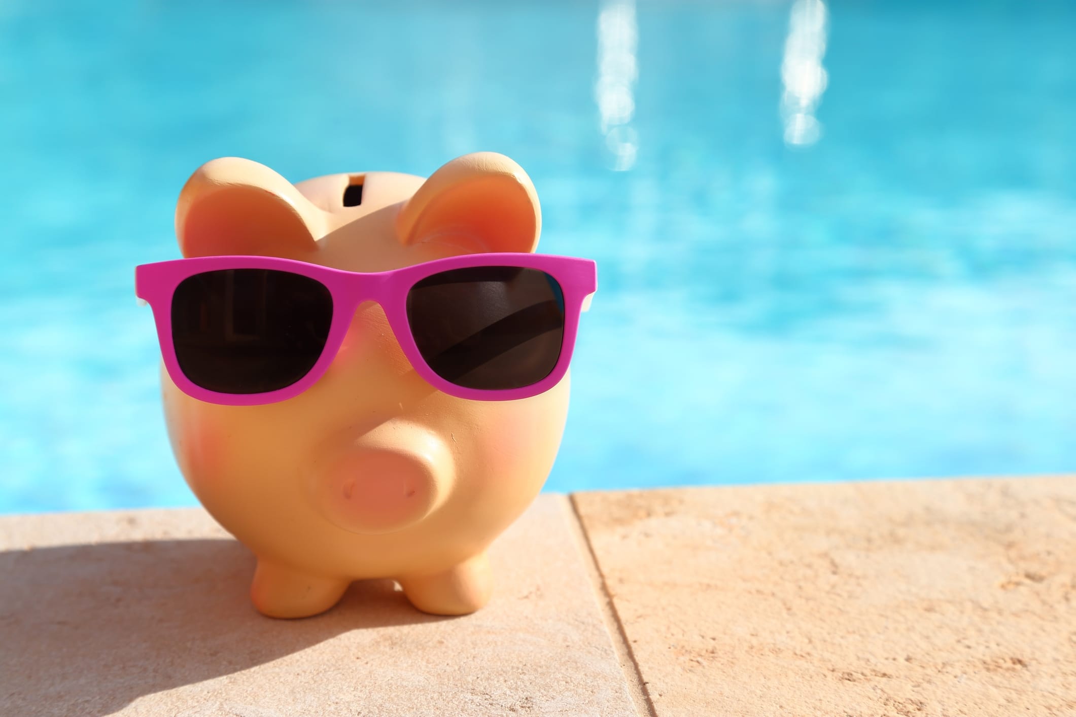 pool financing with piggy bank by swimming pool