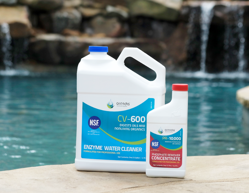 Two bottles of Orenda Pool Chemicals sitting on the ledge of a pool.
